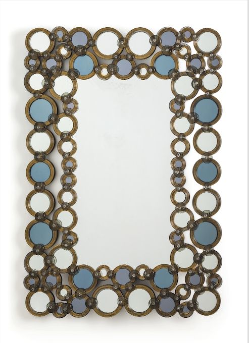 Mirror with hand-worked circles